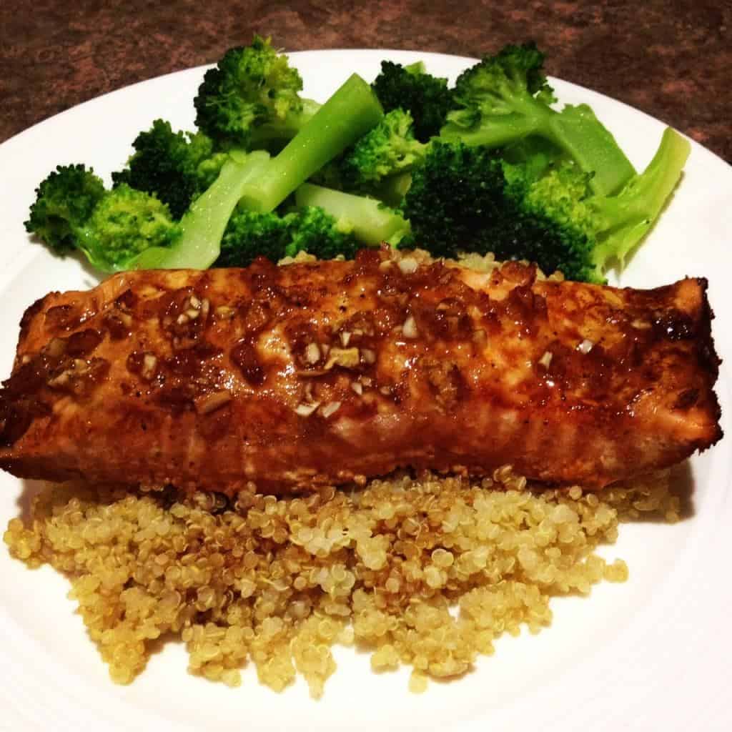White wine and citrus salmon on a white plate