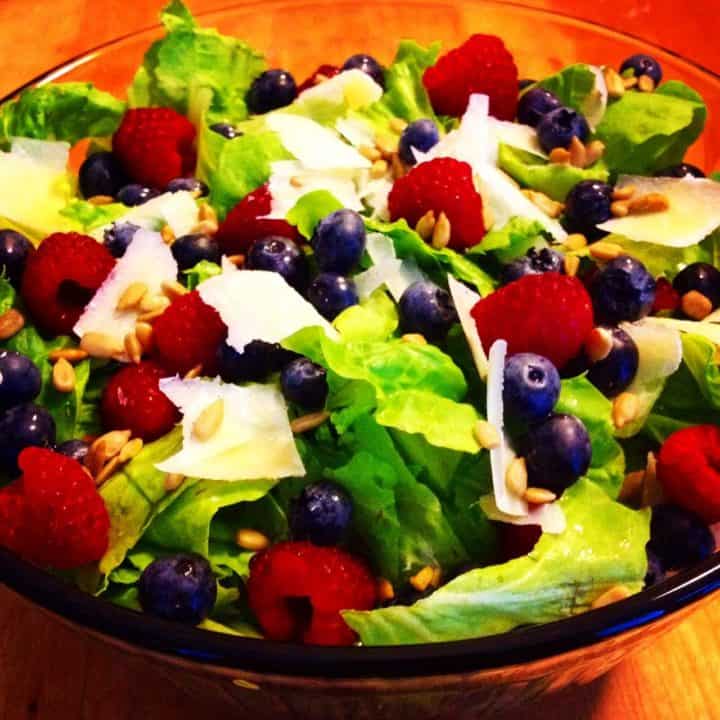 aged asiago and berry salad in a bowl