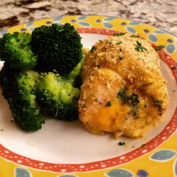 broccoli and chedder stuffed chicken breast on a plate