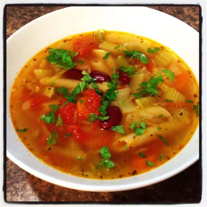 homemade minestrone soup in a white bowl