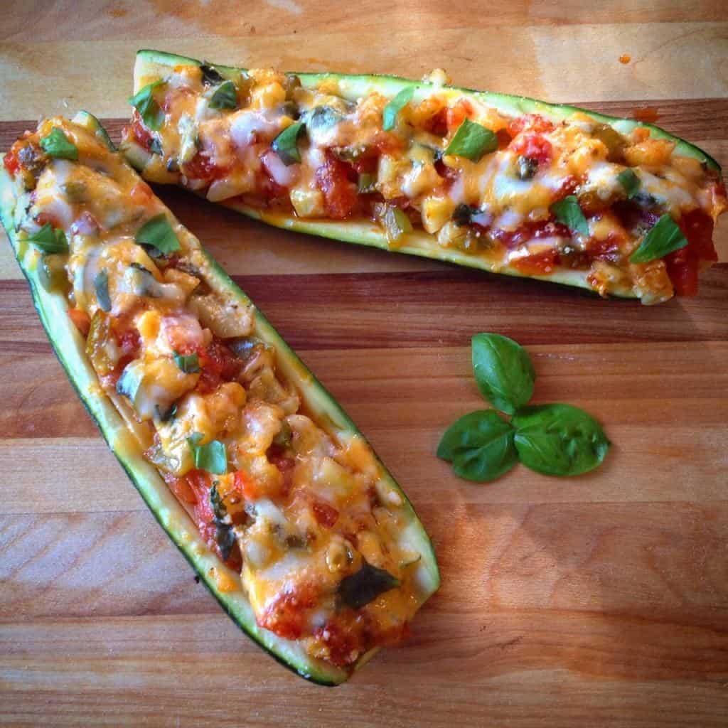Bruschetta Zucchini Boats on a wooden platter