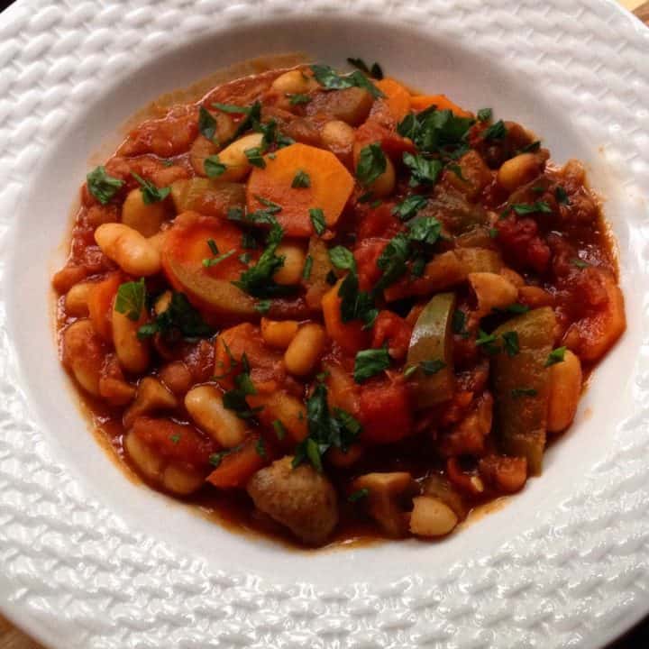 Spicy vegetarian chili in a white plate
