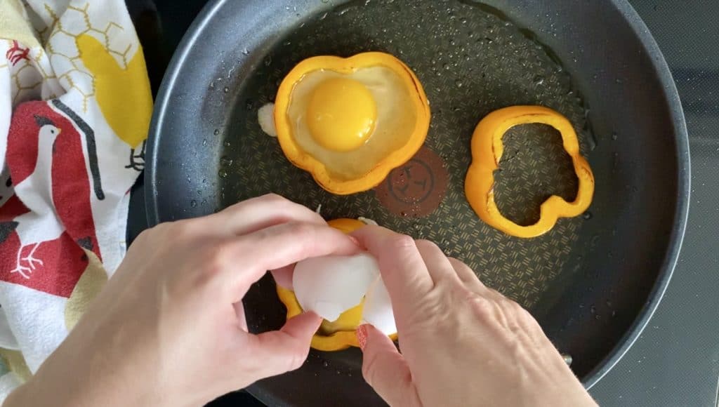 Pepper Ring Eggs - cracking egg