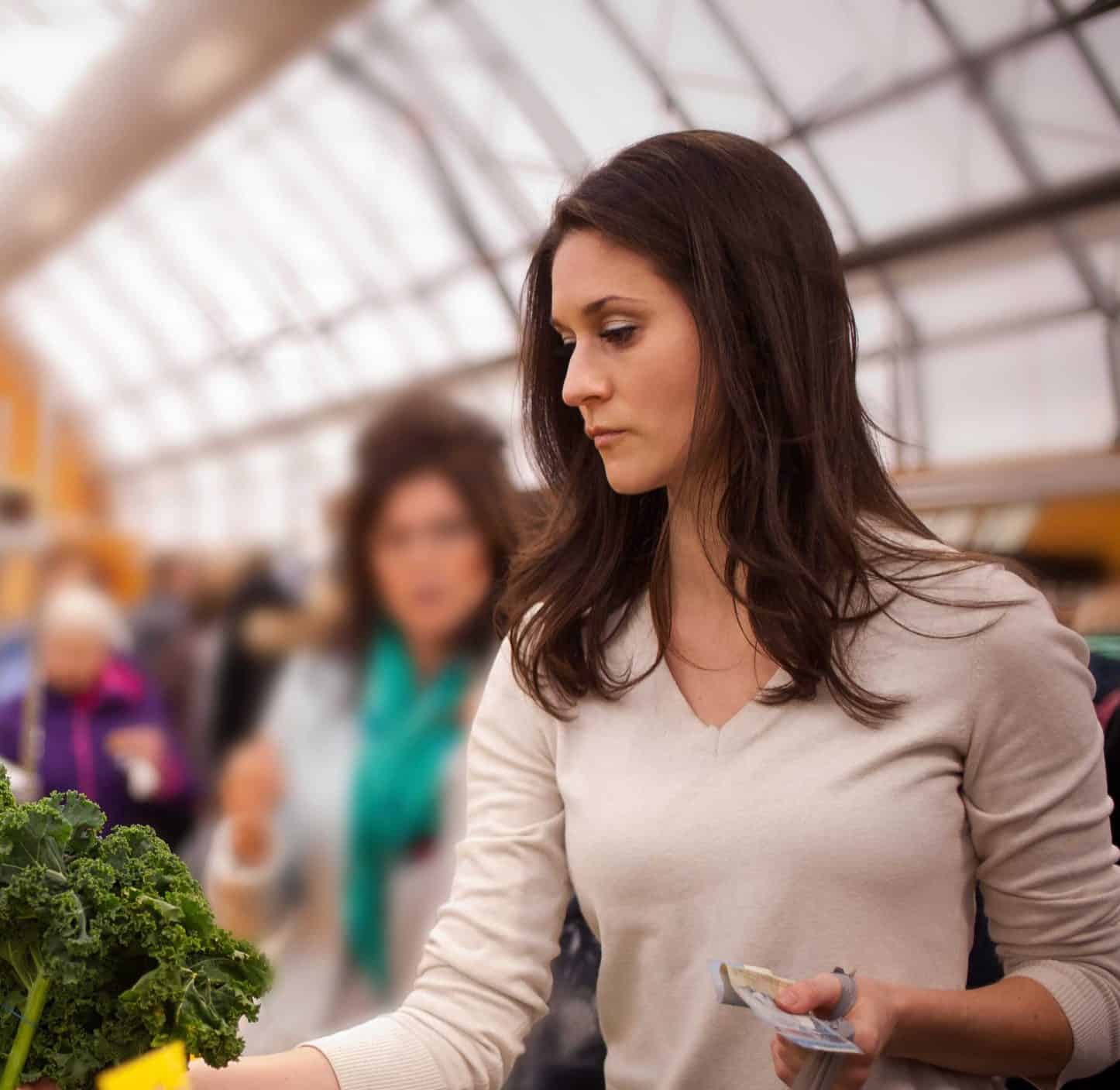 Healthy woman shopping at a grocery store.
