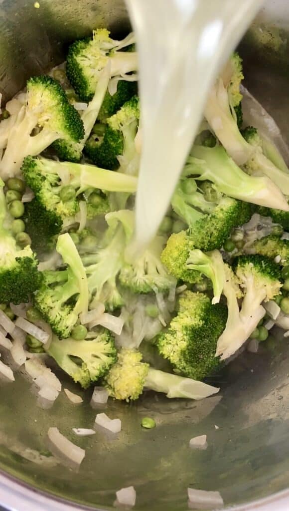 pouring broth into Broccoli Pea instant pot  