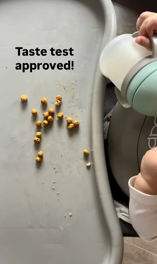 Athena baby eating chickpeas